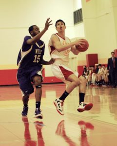 Anthony Medina drives to the basket during the University of St. Thomas Homecoming game.
