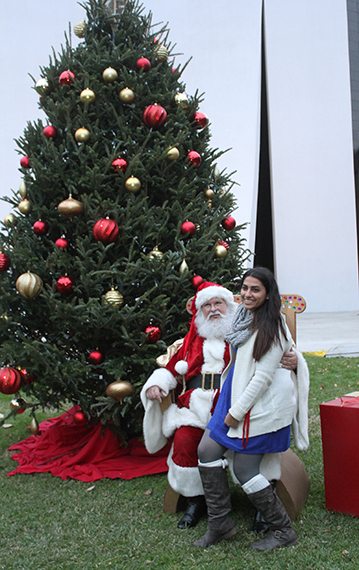 University of St. Thomas - Houston student meets Santa at Deck the Mall
