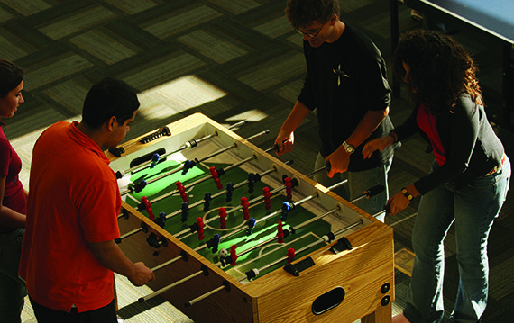 University of St. Thomas - Houston students play foosball in the Student Lounge