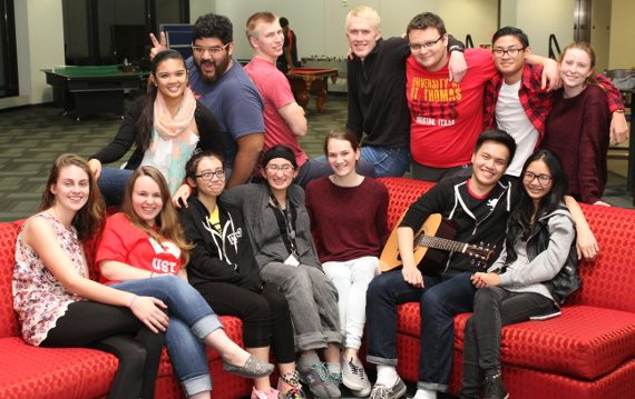 Group of University of St. Thomas - Houston students hang out in a UST student residence