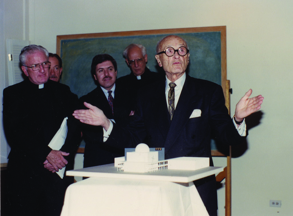 Philip Johnson with model of the Chapel of St. Basil