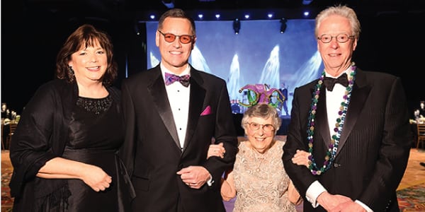 Melynda and Richard Ludwick, Betty Fisher, and Bert Edmundson at the Mardi Gras event.